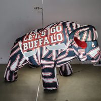 Red, white and black hockey inflatable buffalo glowing with LED lights, front view