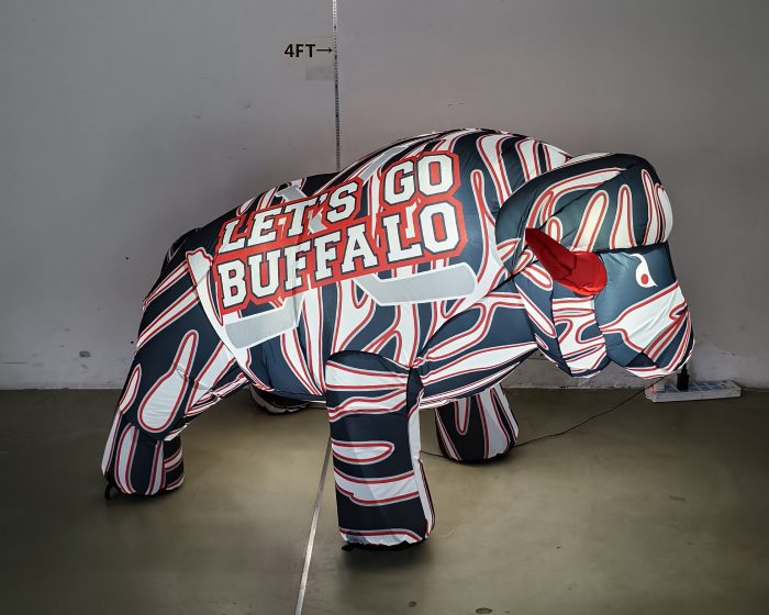 Red, white and black hockey inflatable buffalo glowing with LED lights, front view