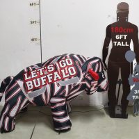 Size comparison of buffalo hockey inflatable next to 6-foot adult silhouette