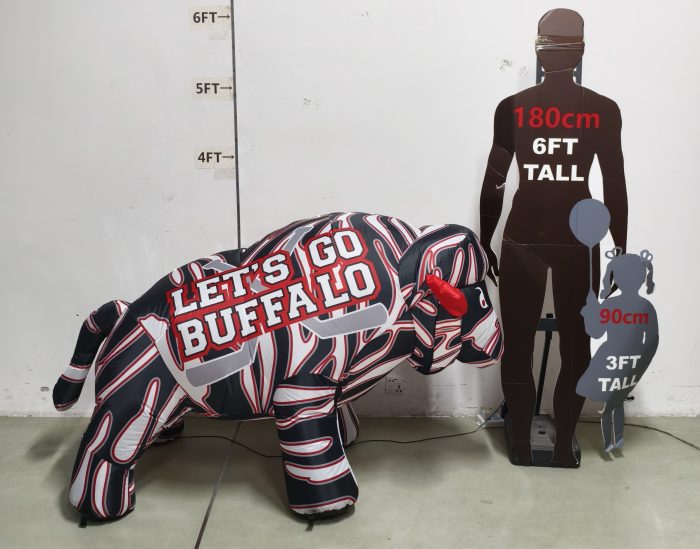 Size comparison of buffalo hockey inflatable next to 6-foot adult silhouette