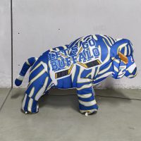 23-inch blue, white and gold striped hockey baby BuffaBlo, daytime side view